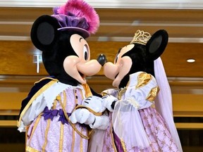 Disney characters Mickey Mouse and Minnie Mouse perform in the Royal Ball lobby during the Disneyland Hotel reopening celebration at Disneyland Paris on February 03, 2024 in Paris, France.